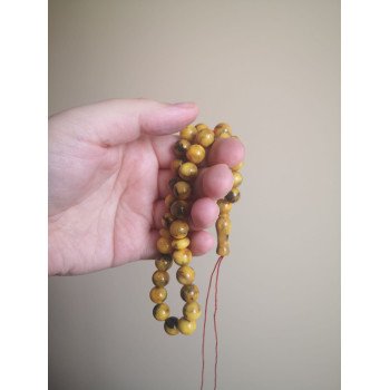 Islamic tasbih with smooth pressed amber beads