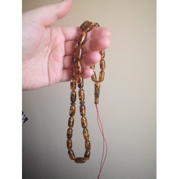Traditional prayer beads with Baltic amber Tube beads