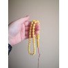 Pressed amber tasbih beads for remembering Allah (dhikr)