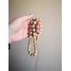 Polished resin prayer beads tasbih with pressed amber
